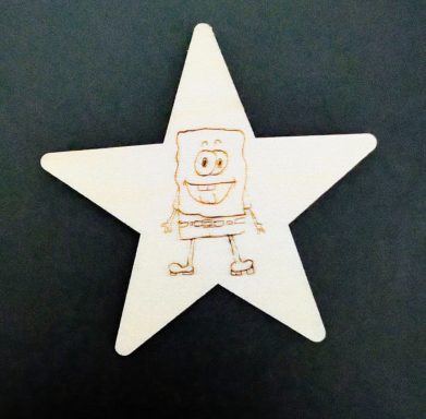 Child's drawing lasered to fridge magnet